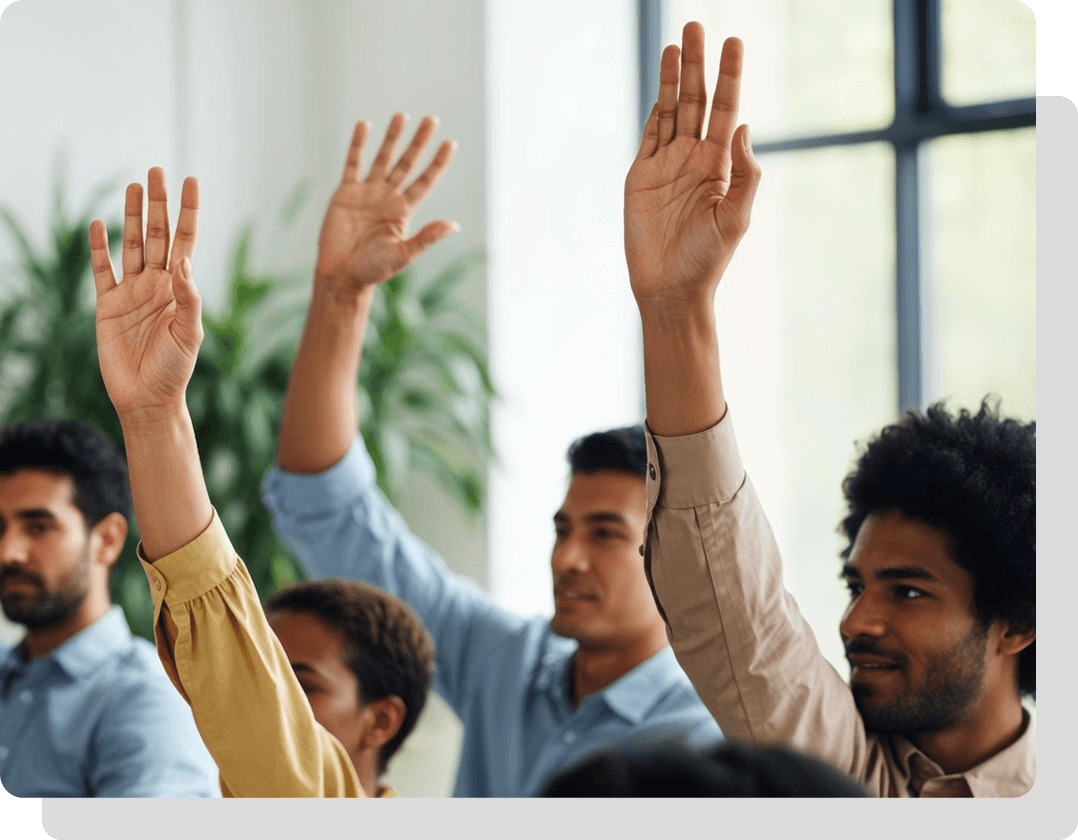 Volunteers with hands raised in group